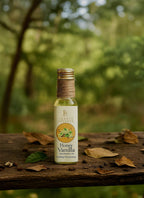 Bottle of honey vanilla product on a wooden surface with a natural background