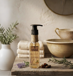 Natural face wash bottle with lavender and turmeric on a rustic wooden tray with botanicals